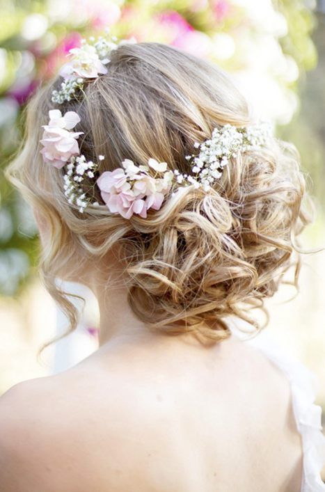 curled updo on medium hair and fresh flowers