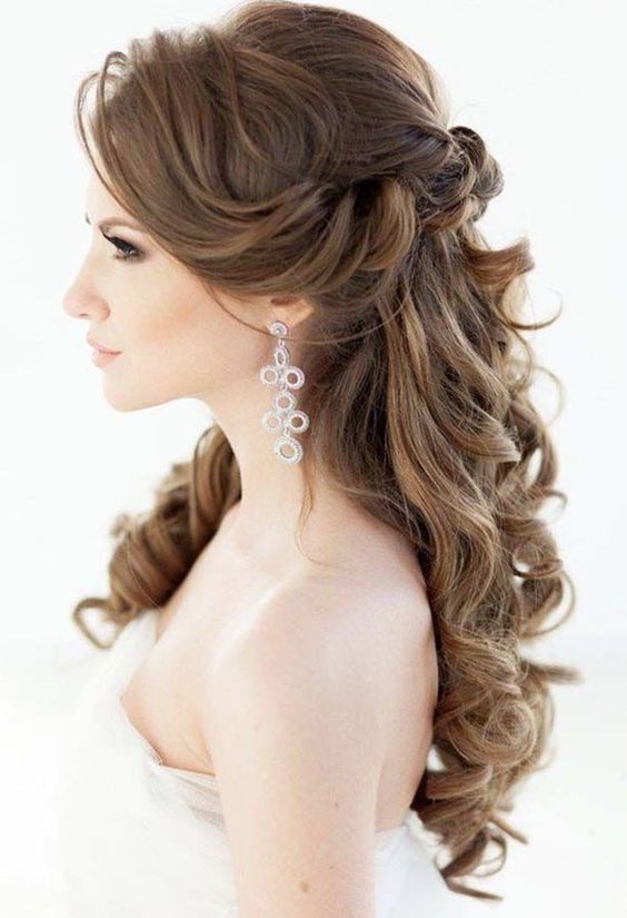 elegant half up half down wedding hairstyle with divine curls