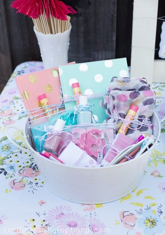 Cute spa bridal shower favors with lip balms, notebooks, everything for pedicure and manicure