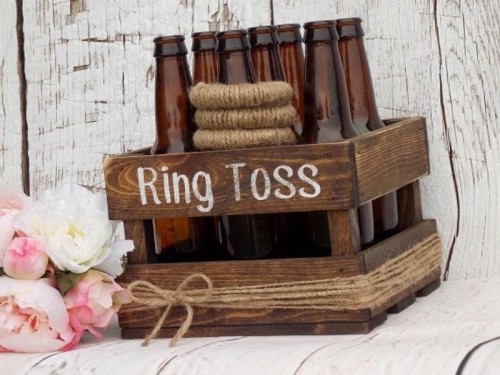 a crate with twine and beer bottles as a ring toss is a pretty idea for a wedding