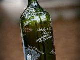 a large wine bottle as a wedding guest book is a creative idea for those who love and enjoy wine