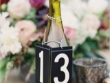 a bottle table number with a doilly is a lovely and pretty idea to style your table and mark its number