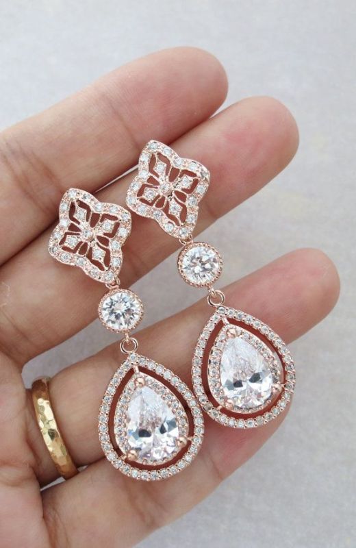 Elegant statement earrings given in the morning can be worn during the wedding day and will be a very memorable gift