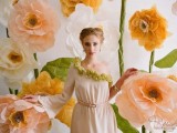 a bright wedding ceremony space with oversized peachy blooms is a catchy idea for a spring or summer wedding, it can be designed as a photo booth, too