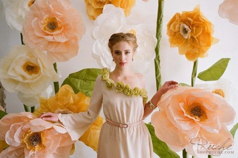 a bright wedding ceremony space with oversized peachy blooms is a catchy idea for a spring or summer wedding, it can be designed as a photo booth, too