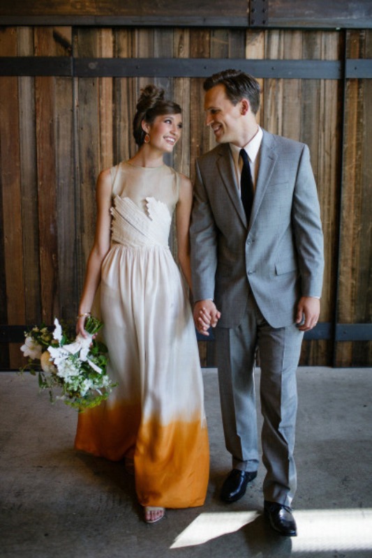 a sleeveless dip dye wedding dress with a textural bodice, a dip dye yellow skirt and an illusion neckline