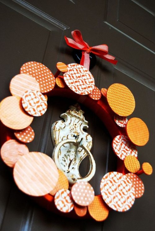 a bright fall wedding wreath of colorful circles and a printed ribbon bow is a lovely idea for a fall wedding