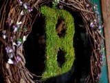 a fall vine wreath with lilac and green blooms and with a moss monogram is a very stylish and bold idea for the fall