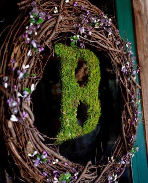 a fall vine wreath with lilac and green blooms and with a moss monogram is a very stylish and bold idea for the fall