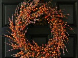 a cute berry wreath for fall and winter weddings