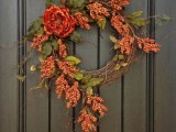 a small and bright vintage fall wreath with lots of faux berries, twigs and a single bloom is a very pretty and cool idea for the fall