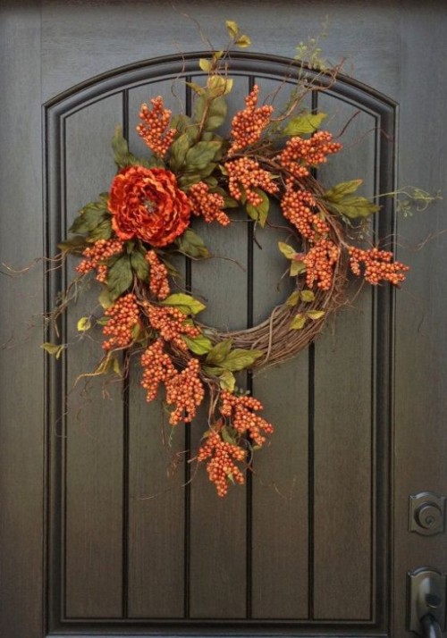a small and bright vintage fall wreath with lots of faux berries, twigs and a single bloom is a very pretty and cool idea for the fall