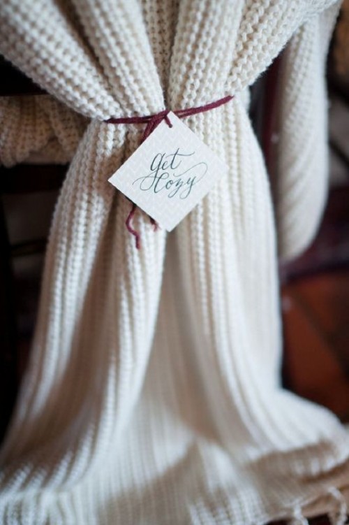 cover the chairs with knit covers and tags instead of usual covers and signs to give your venue a boho feel