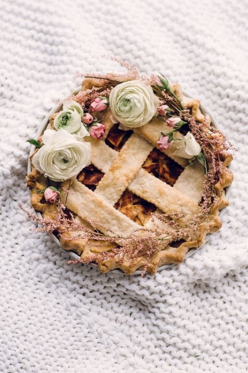 a fruit and berry pie topped with fresh blooms is a nice boho alternative to a usual formal wedding cake
