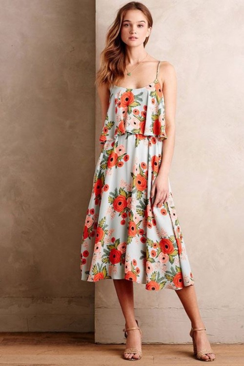 a spaghetti strap midi dress with a bright floral print and nude heels plus a statement necklace