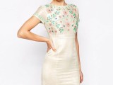 an embroidered floral mini dress with short sleeves and a high neckline for a boho bride-to-be