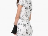 a black and white bodycon knee dress with a black clutch is a simple and elegant monochromatic outfit