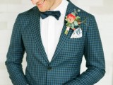 a lovely blue and navy checked print suit, a white shirt and a teal bow tie plus a bold floral boutonniere