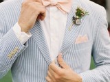 a coastal gorom’s look with a light blue striped suit, a white shirt and a pink bow tie is very airy