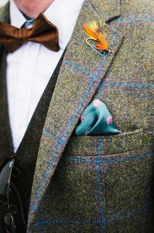 a grey suit with a colorful windowpane suit, a white shirt and a brown waistcoat for a catchy look