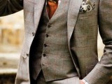 a stylish look with a grey plaid three-piece suit, a white shirt and a red tie is always a good idea