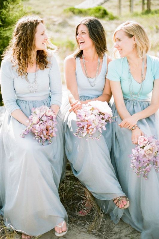 Mismatching mint blue and green tops and baby blue maxi skirts for a beautiful ocean inspired wedding