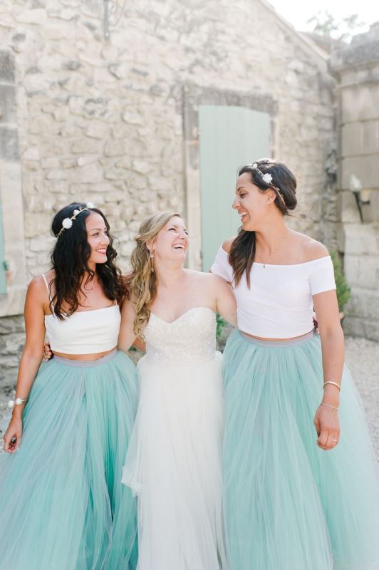 White crop tops and mint green tulle full maxi skirts for a relaxed and playful bridesmaid look with a touch of a pastel color