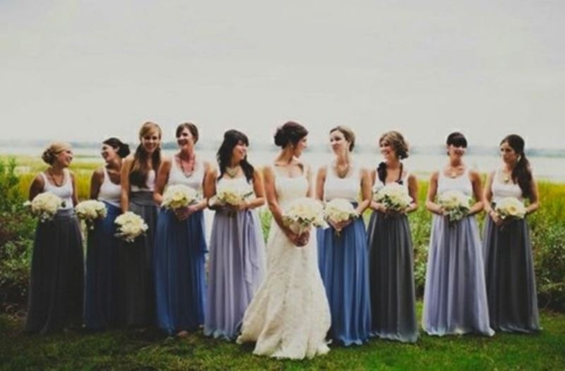 White tank tops and mismatching blue maxi skirts for a laid back countryside wedding