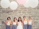 white lace corset tops and graphite grey tulle skirts plus statement necklaces for a very contrasting and bold bridesmaid look