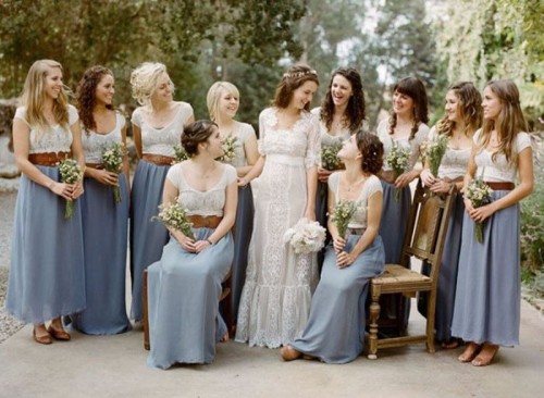 mismatching white plain and lace tops and blue maxi and midi skirts plus brown belts and brown shoes for a rustic spring or summer bridal party look