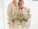 neutral tulle mini dress, neutral faux fur coveurps, white tights and tan shoes for a heavenly beautiful winter flower girl look