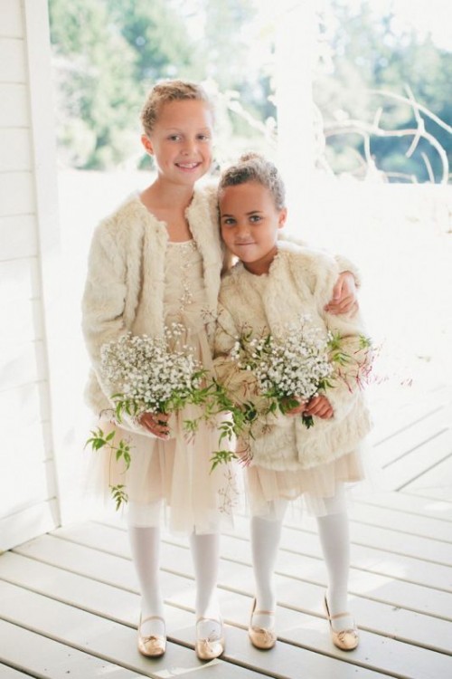 neutral tulle mini dress, neutral faux fur coveurps, white tights and tan shoes for a heavenly beautiful winter flower girl look