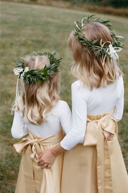 white long sleeve tops, tan A-line maxi skirts, greenery crowns with bows for modern and stylish inter flower irls