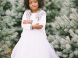 a white maxi dress with a tutu skirt, a white cardigan with patterns make up a chic and girlish winter outfit