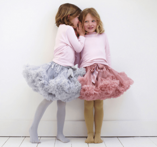 pink long sleeve tops, pink and blue tull over the knee skirts and tights for fun and whimsy modern winter flower girls