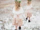 blush knee floral A-line dresses, white faux fur coverups, ugg boots and greenery and flower crowns
