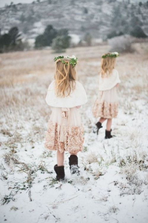 blush knee floral A-line dresses, white faux fur coverups, ugg boots and greenery and flower crowns