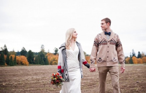tan pants, a grey shirt, a navy bow tie and a printed tan cardigan for a chic and casual look and for a homey feel