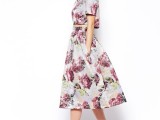 a floral ensemble with a crop top with short sleeves and an A-line midi skirt plus floral shoes for a bridesmaid