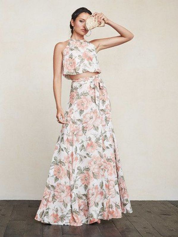 A floral outfit with a halter neckline crop top and a maxi skirt for a spring or summer wedding