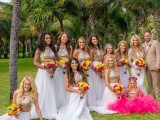 bright bridesmaid looks with colorful embellished halter neckline crop tops and white maxi skirts for a tropical wedding
