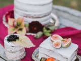 a semi-naked square wedding cake decorated with blooms and topped with figs is a cool and delicious idea for a fall wedding