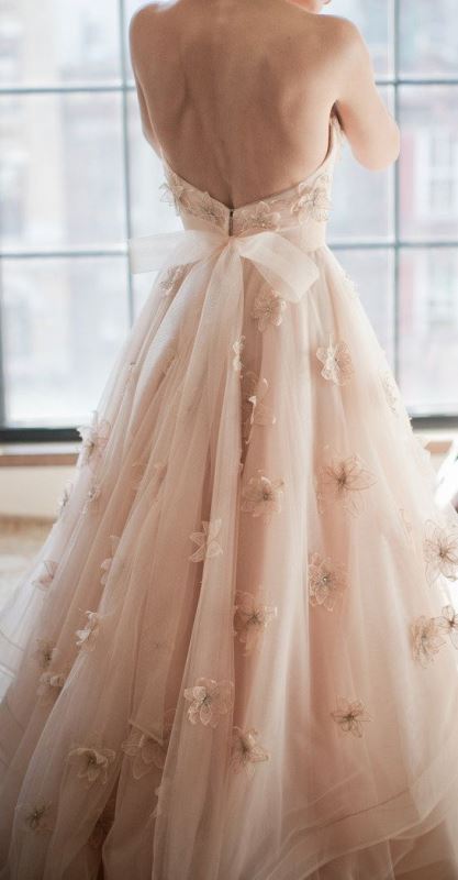 a blush wedding ballgown with realistic floral appliques and a cutout back is a gorgeous and very feminine wedding dress idea