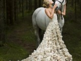 a fab romantic A-line strapless wedding dress with a skirt with a train accented with petal appliques for a chic look