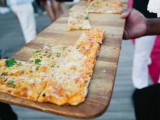 serve pizza on large cuttong boards to make them look cooler and cozier