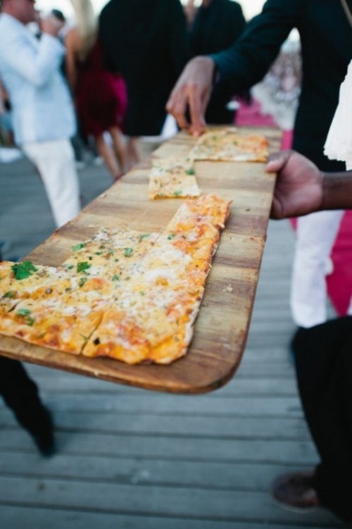 serve pizza on large cuttong boards to make them look cooler and cozier