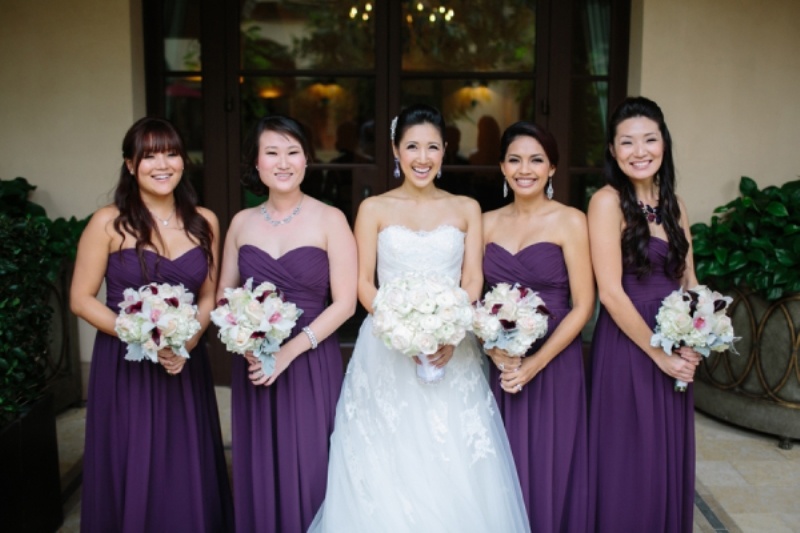 strapless violet bridesmaid dresses with draped bodices and pleated skirts are a timeless solution for a bold fall wedding