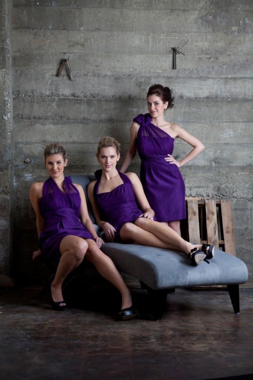 mismatching bright purple knee bridesmaid dresses and black shoes are a stylish and contrasting solution for a fall or winter wedding