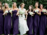 deep purple strapless maxi bridesmaid dresses with pleated skirts are amazing for refined and chic fall and winter weddings