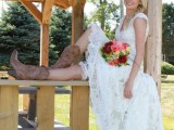 a midi lace A-line wedding dress paired up with brown embroidered boots for a stylish fall wedding look